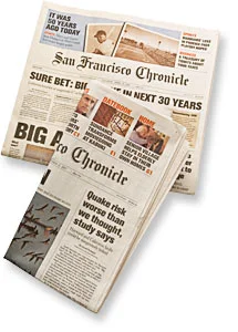 San Francisco Chronicle newspapers showing earthquake prediction headlines.